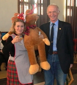 John Mackison presents Elisabeth Matell  with the toy reindeer which she has won in the raffle.