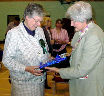 President Mrs Cherry Howard thanks the judge  on behalf of the club  and presents her with a glass decanter  engraved with the head of a Norfolk.